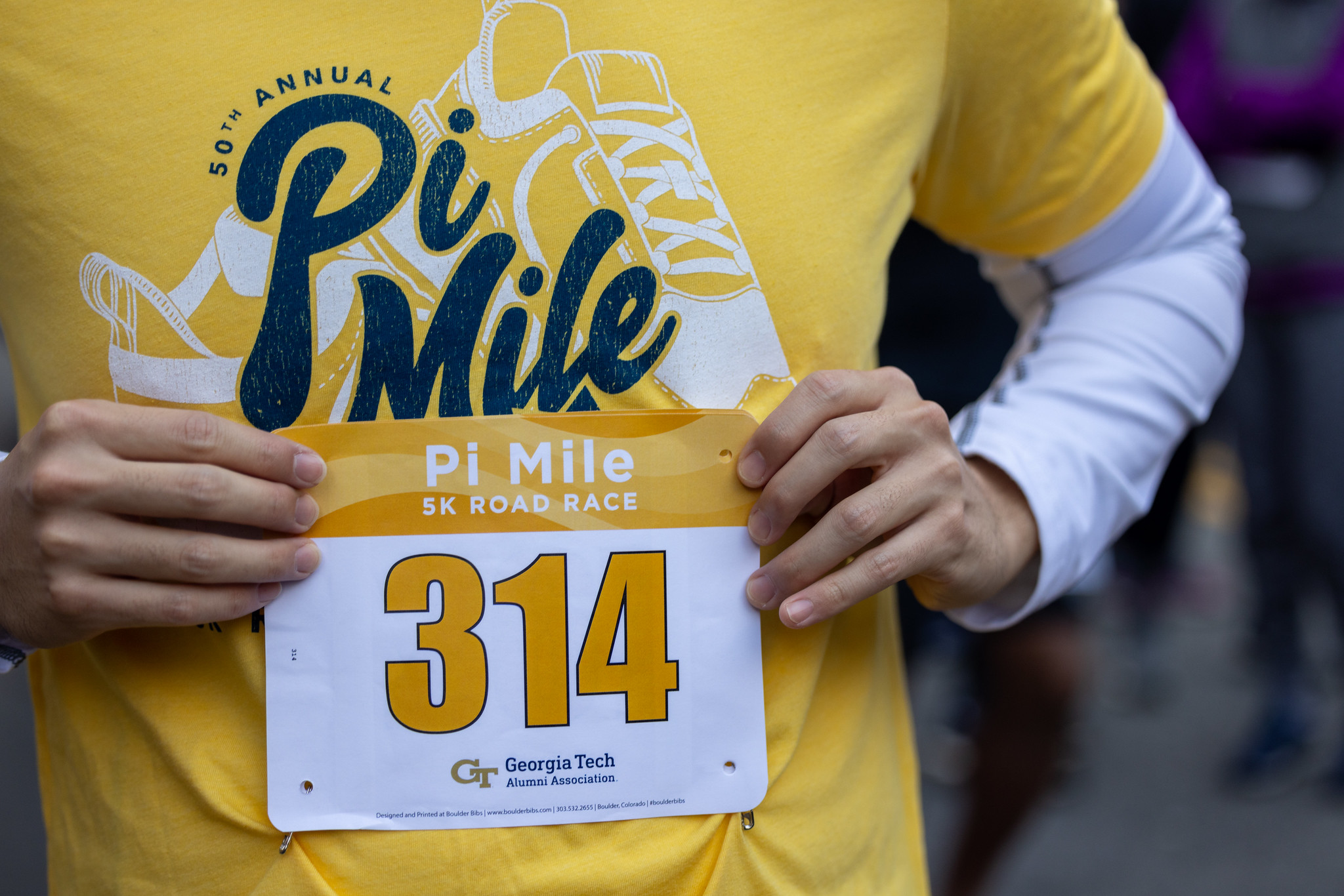 Closeup of Pi Mile tshirt and race number